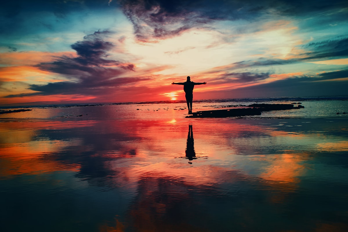 Cross silhouette at sunset symbolizing hope
